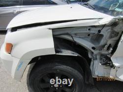 Used Wheel fits 2009 Jeep Grand cherokee 18x8 aluminum chrome clad Grade C